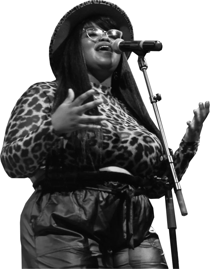 A musician performing on stage at the Gem Theater